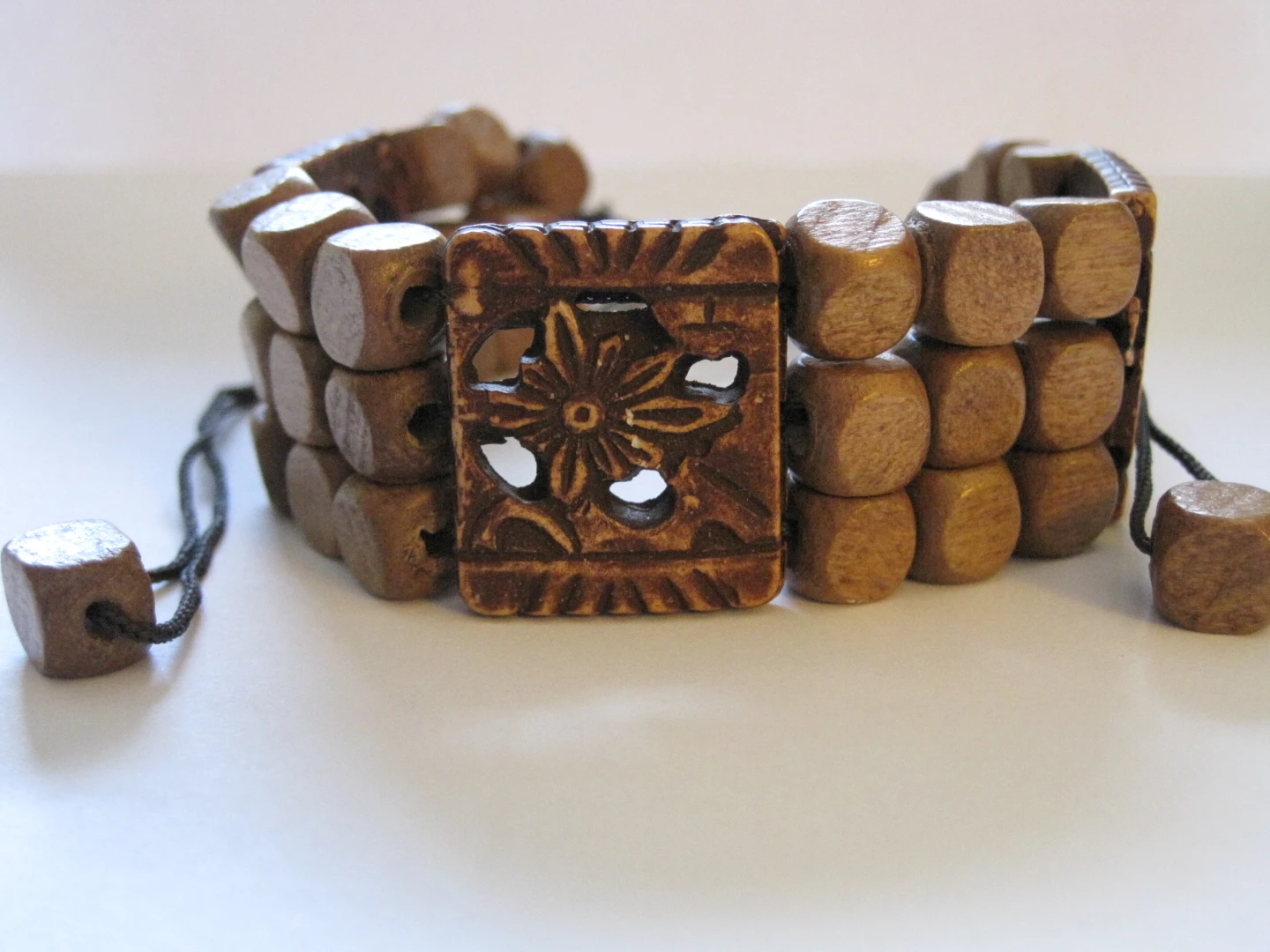 Wooden Bead Bracelet with Carved Centerpiece