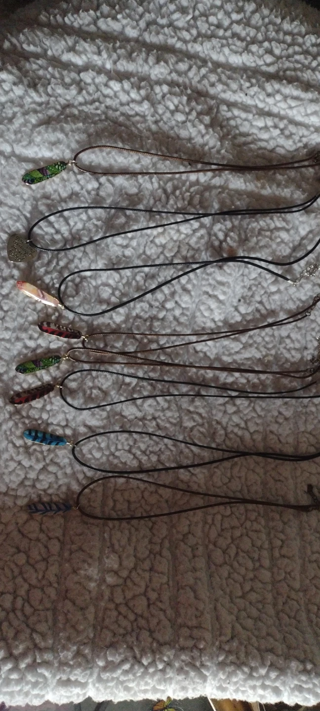 Assorted Feather and Heart Pendants on Necklaces
