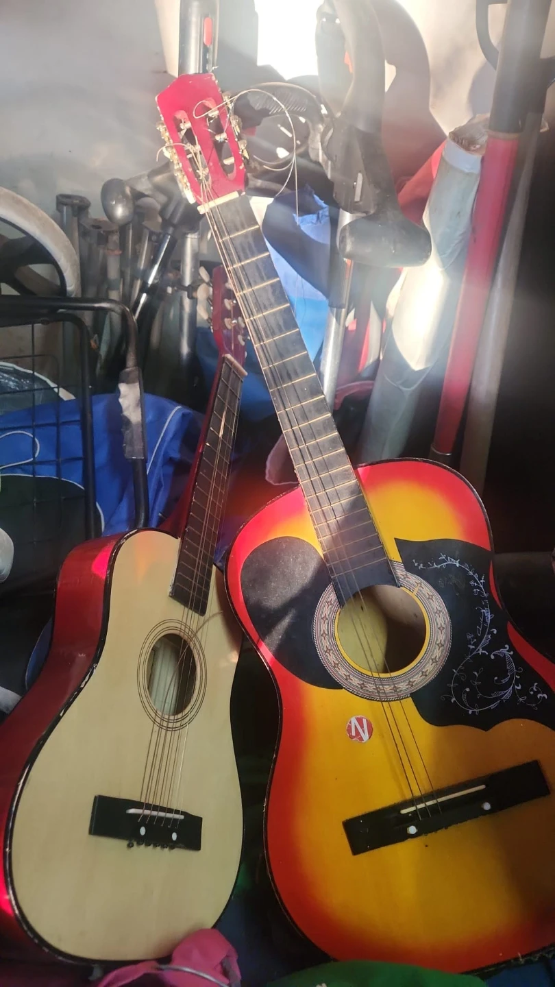 Two Acoustic Guitars - Red and Sunburst
