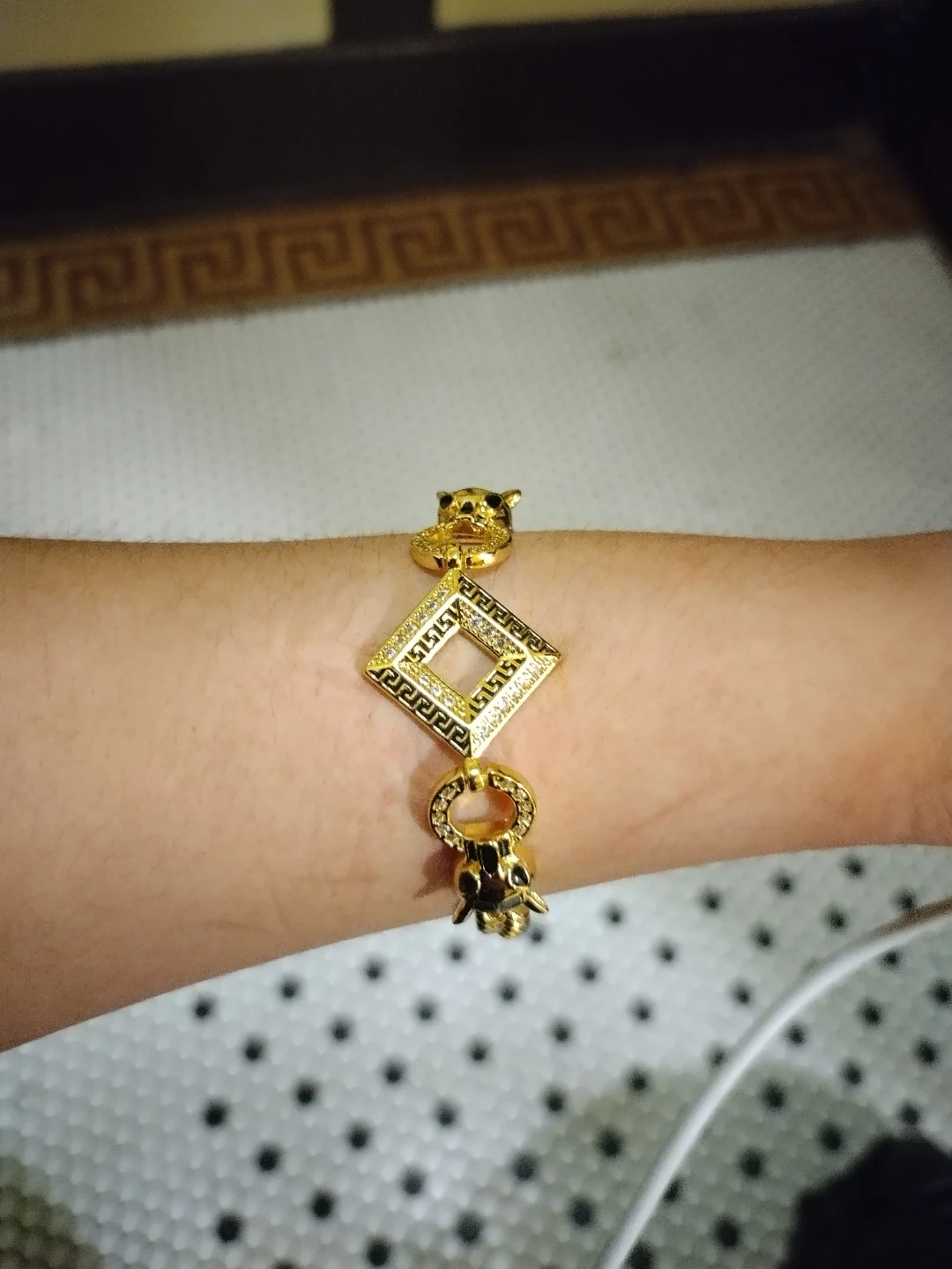 Gold Tone Bracelet with Panther and Geometric Charm