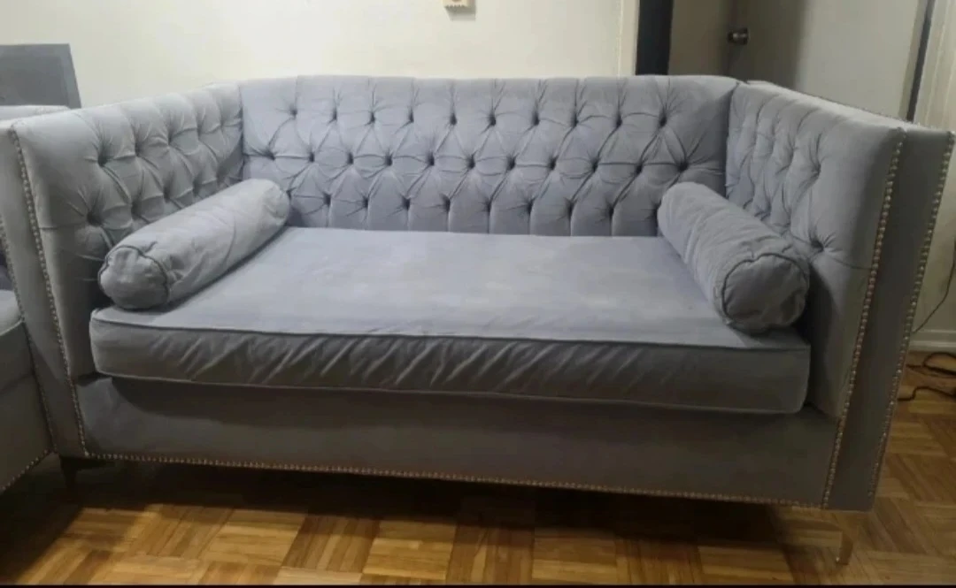 Grey Tufted Sofa with Bolster Pillows
