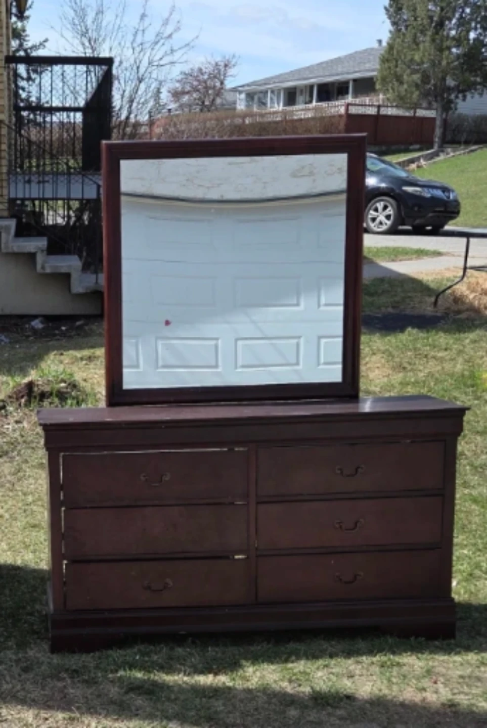 Wooden curio cabinet with glass doors
