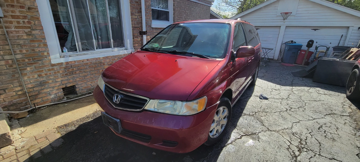Red Honda Odyssey Minivan