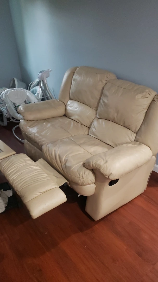 Cream Leather Reclining Loveseat