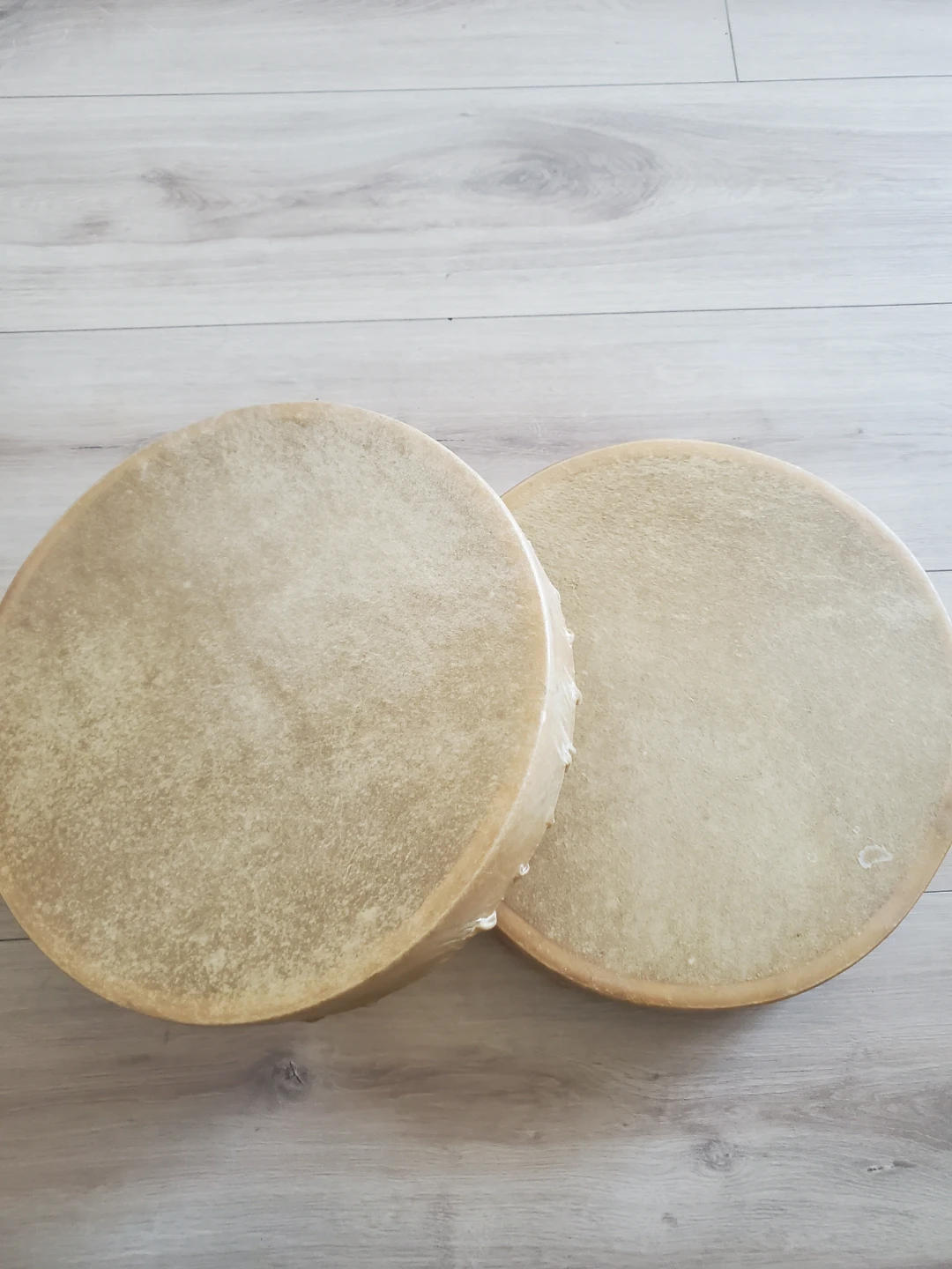 Two handmade frame drums