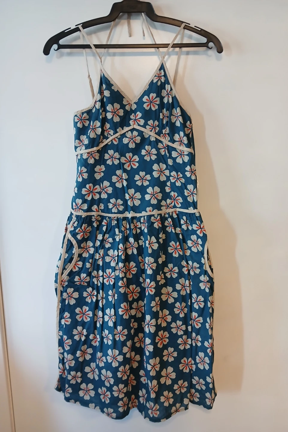 Striking blue floral dress size 10. It's available.
