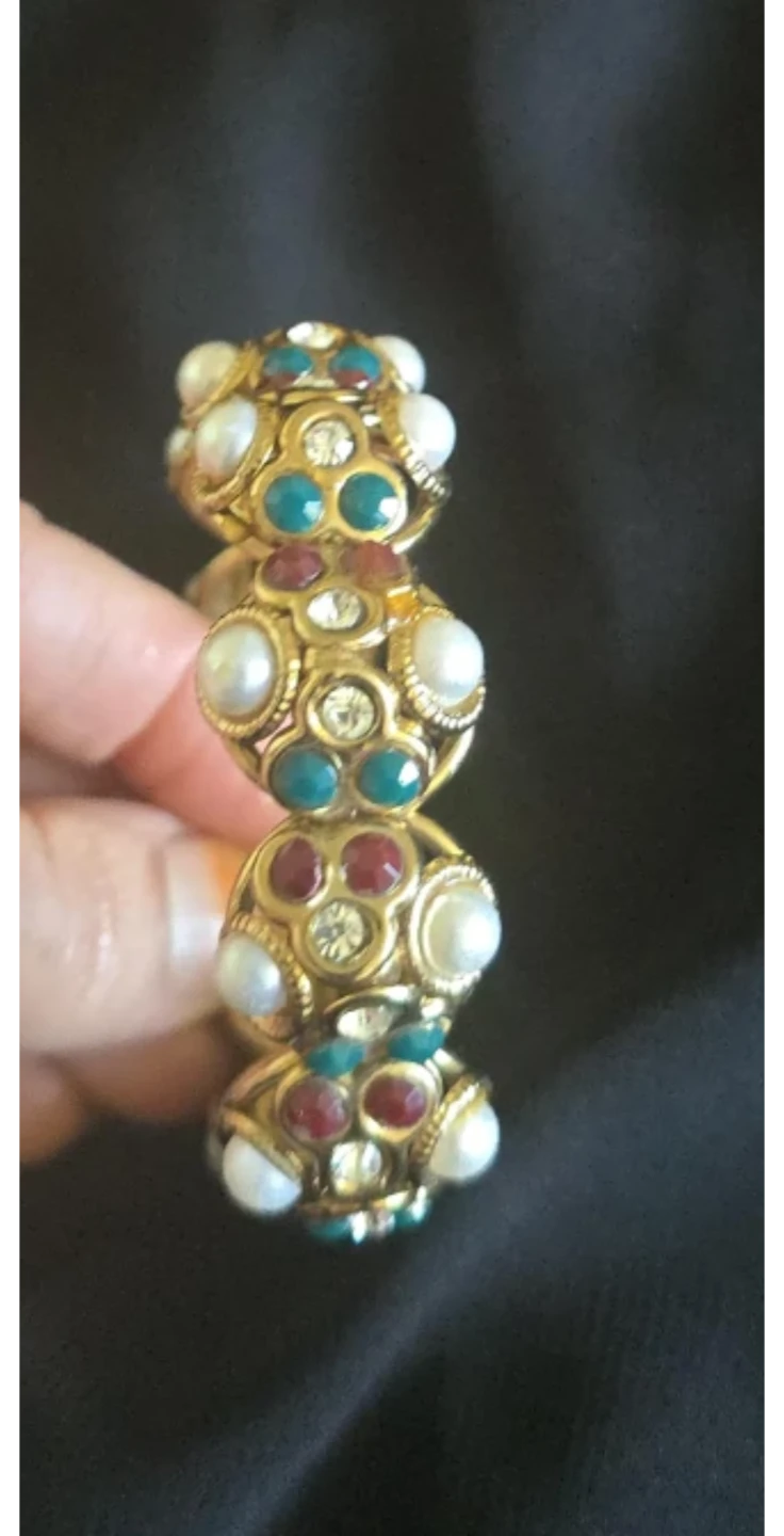 Gold tone statement bracelet with faux pearls and gems