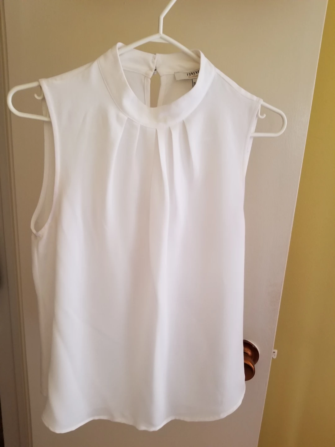 White Sleeveless Mock Neck Top