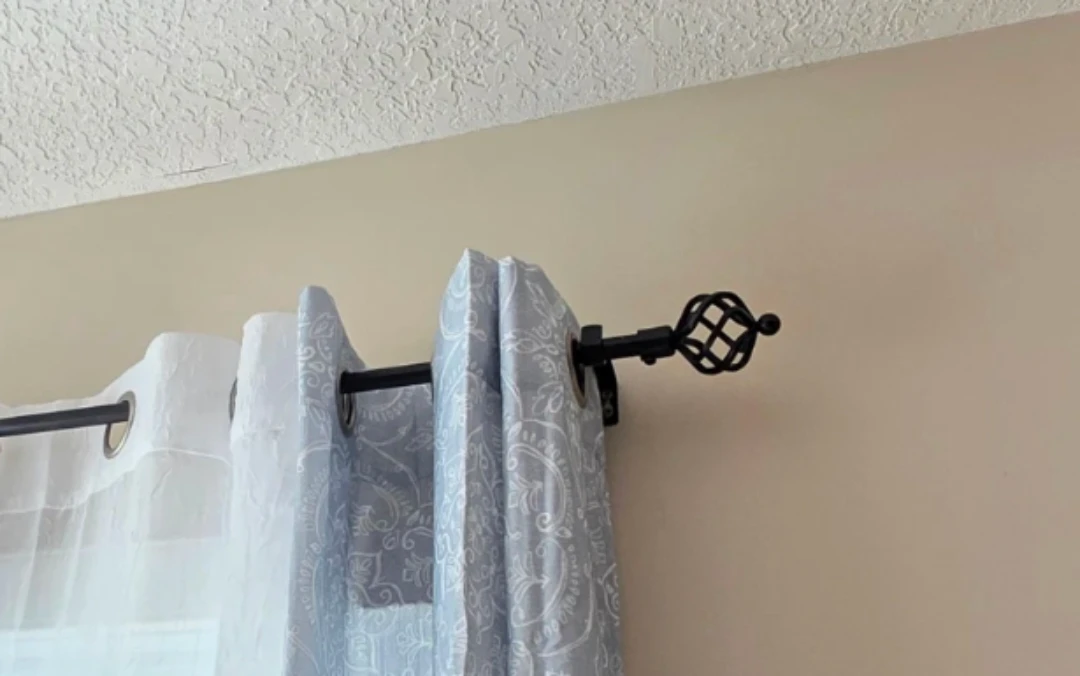 Black curtain rod with ends and brackets