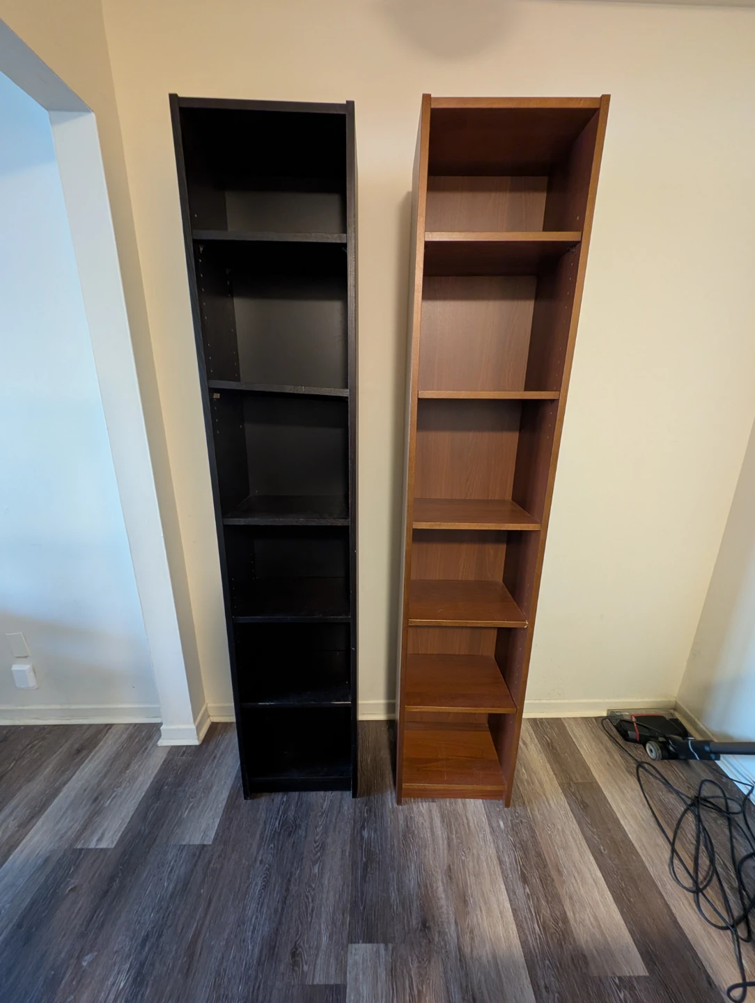 Two tall bookshelves - black and wood finish