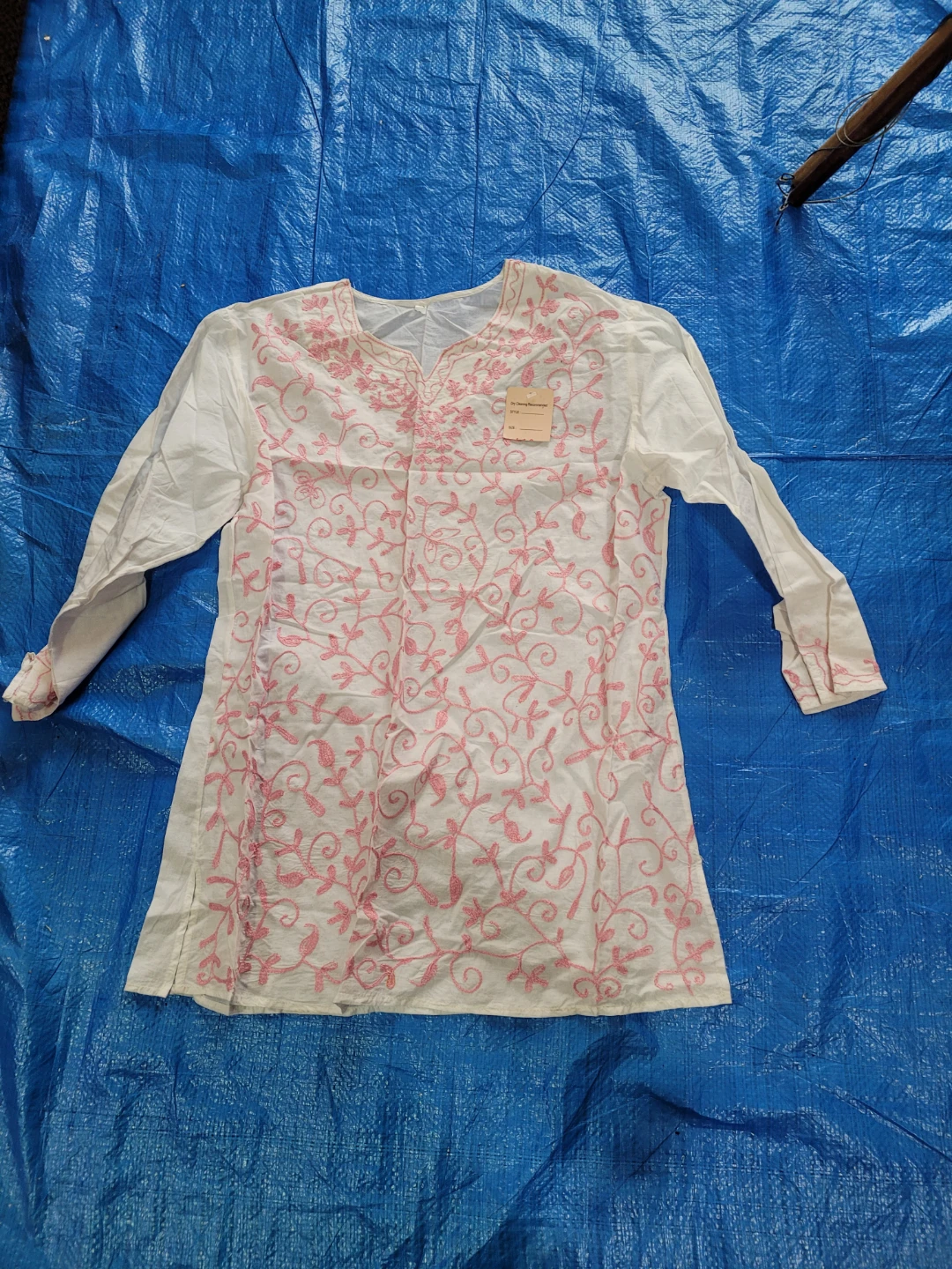 White embroidered kurti with pink floral detail