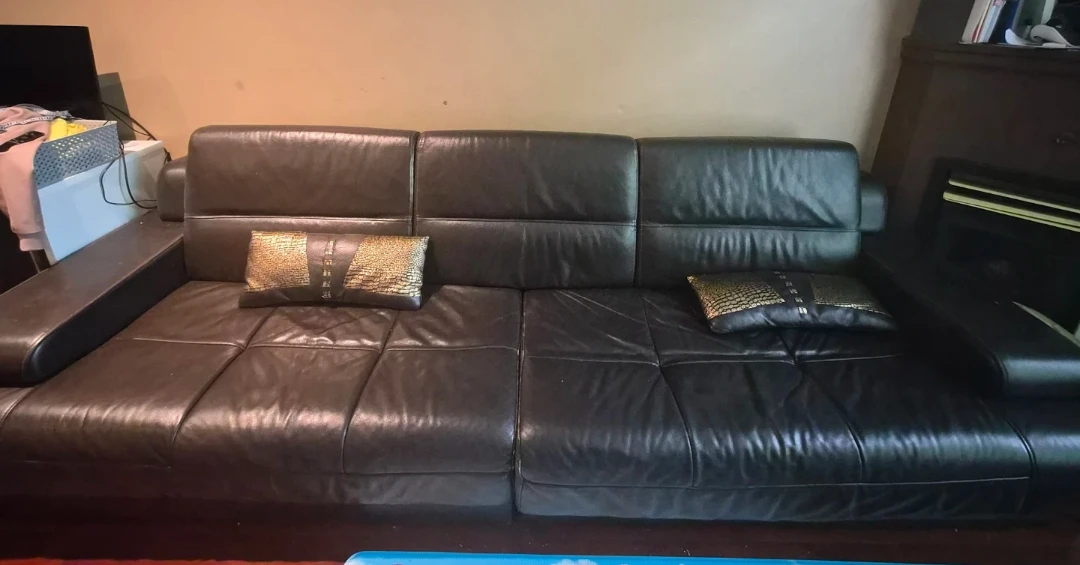 Brown Leather Sofa with Decorative Pillows