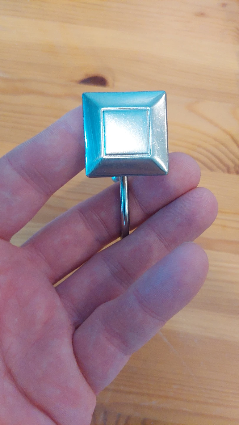 Polished Stainless Steel set of 12 curtain hooks.