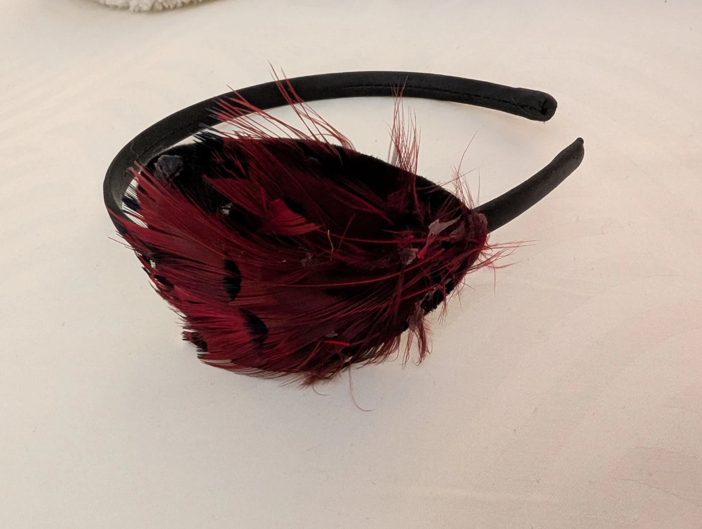 Black Headband with Red Feather-Like Accents