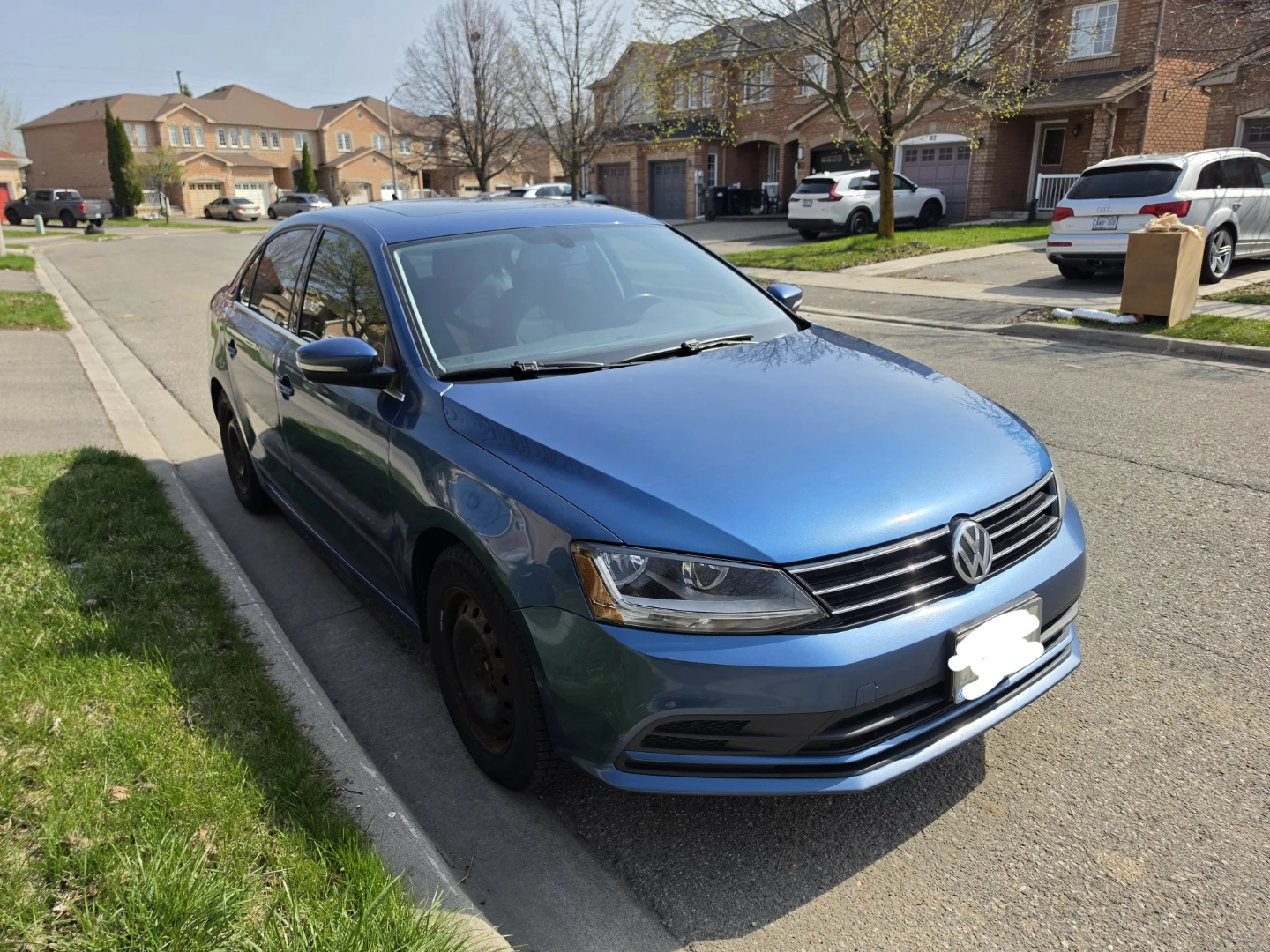 Blue Volkswagen Jetta TSi Sedan
