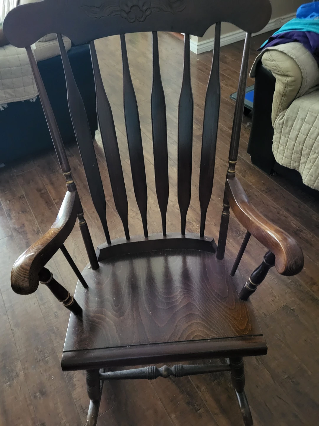 Dark Wood Rocking Chair with Carved Top