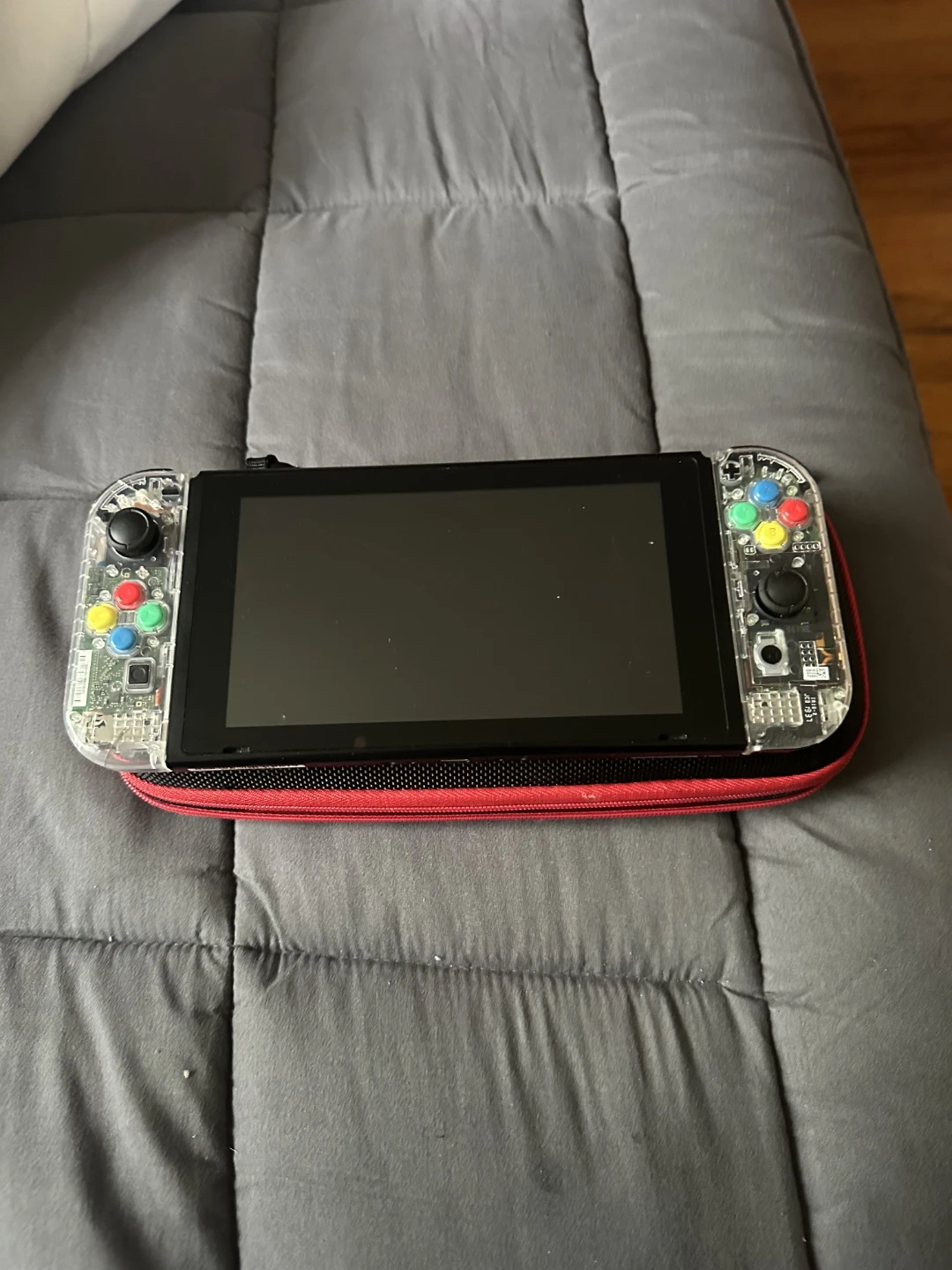 Nintendo Switch Console with Clear Joy-Cons and Red Case