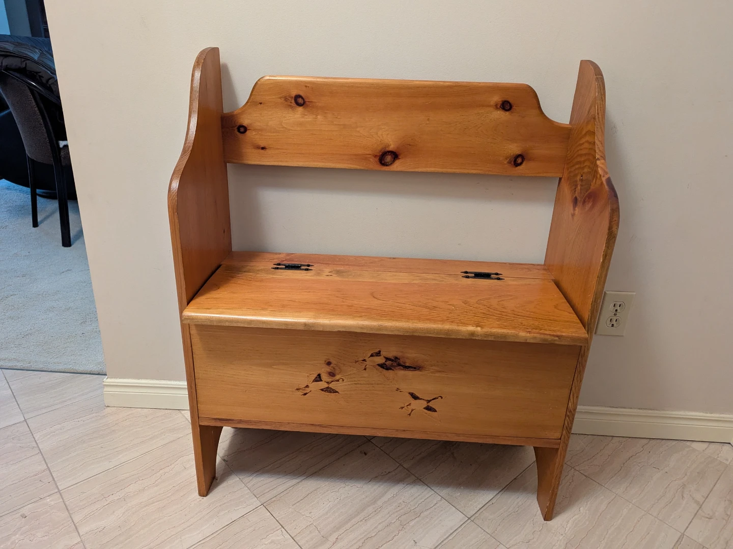 Wooden storage bench with duck motif