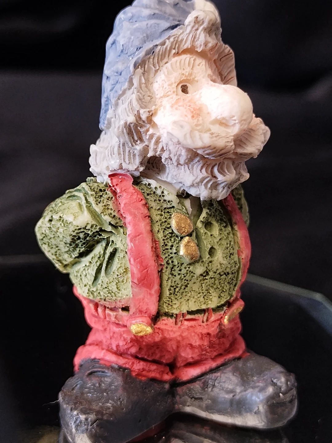Figurine of a gnome holding flowers