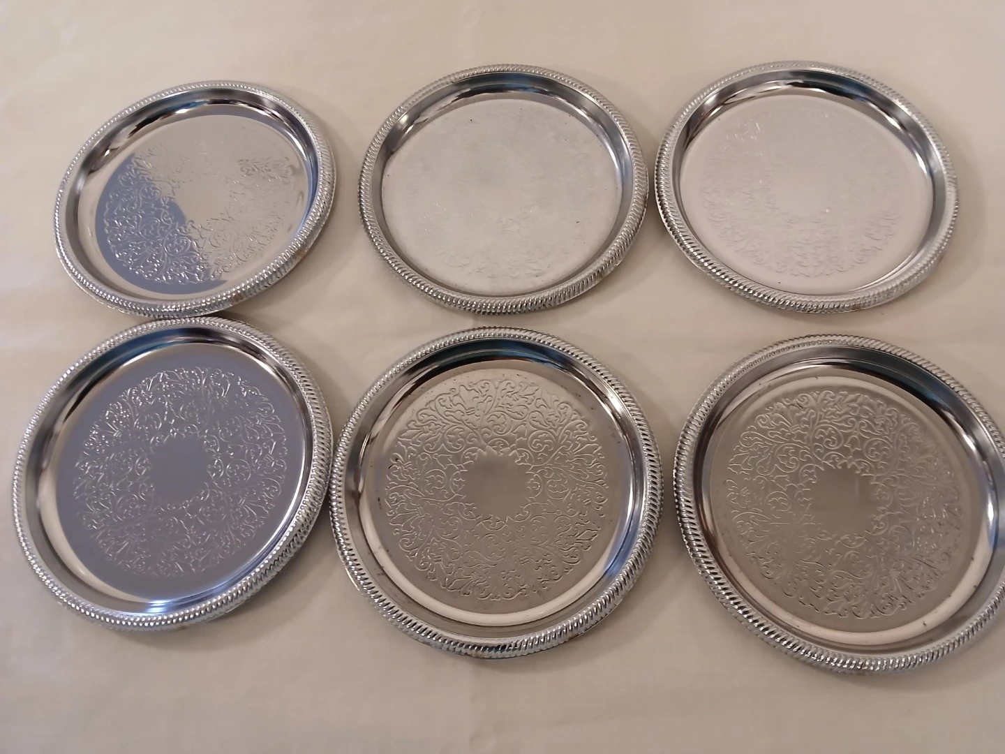 Set of 6 Silver Coasters with Embossed pattern. Pick up only.