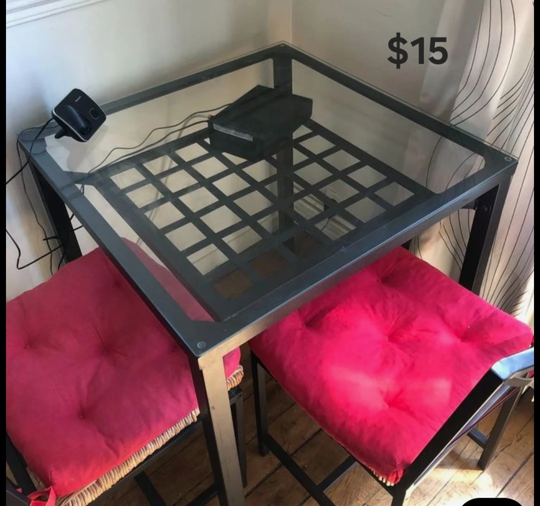 Glass top dining table with two chairs