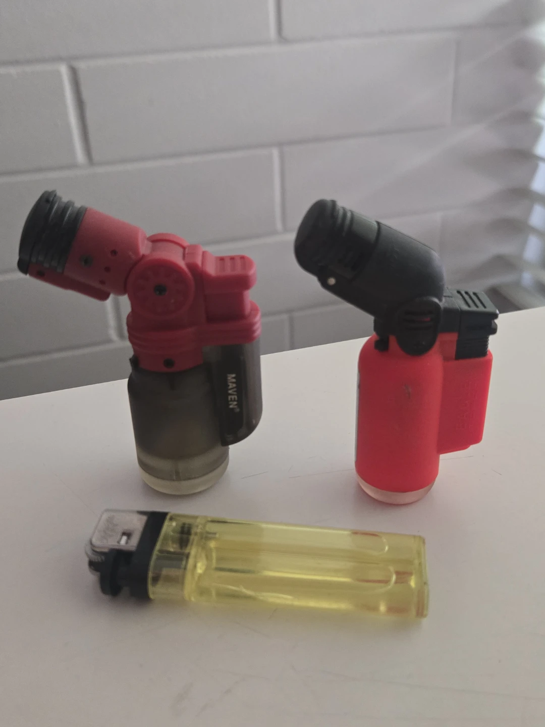 Maven and Red Torch Lighters with Yellow Bic Lighter