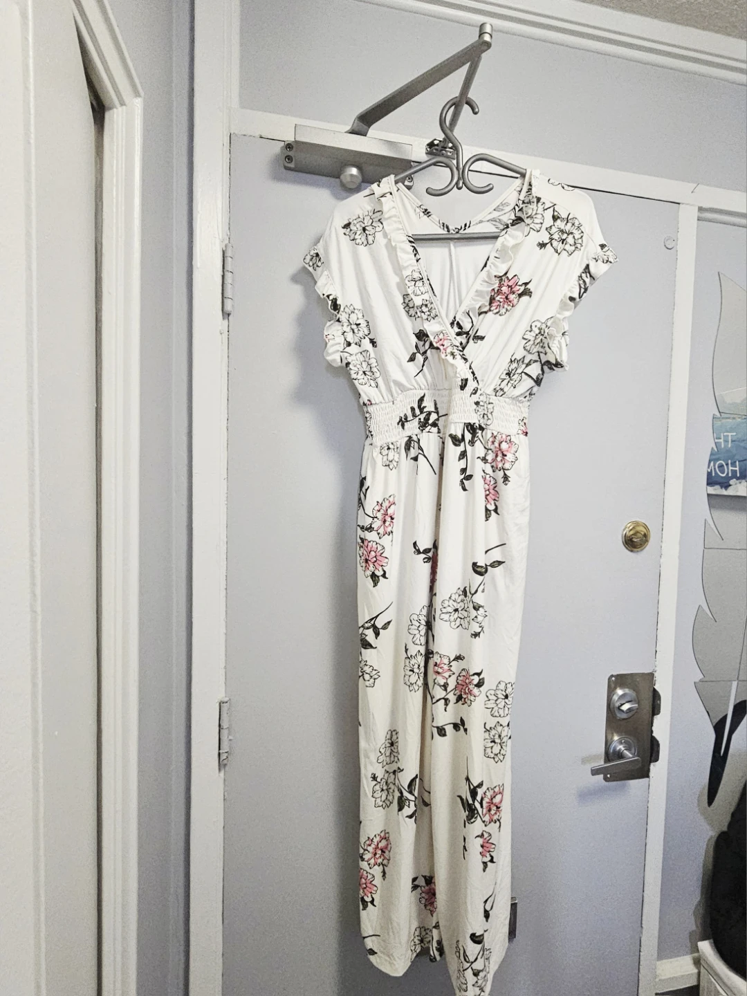 White floral print jumpsuit with ruffle trim