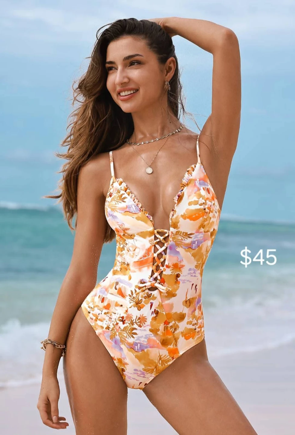 One-piece swimsuit with floral print and lace-up front