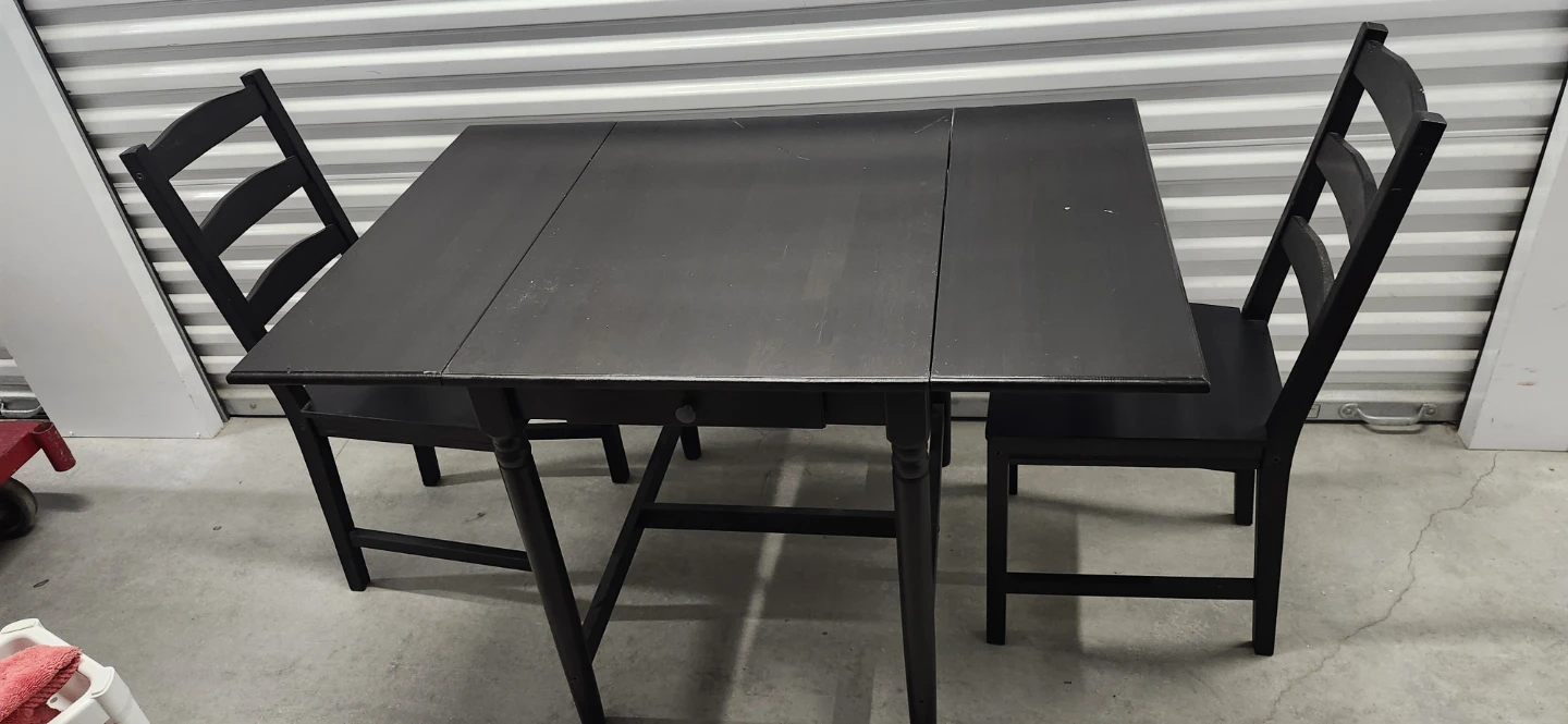 Ikea dinning table with drawer with two chairs