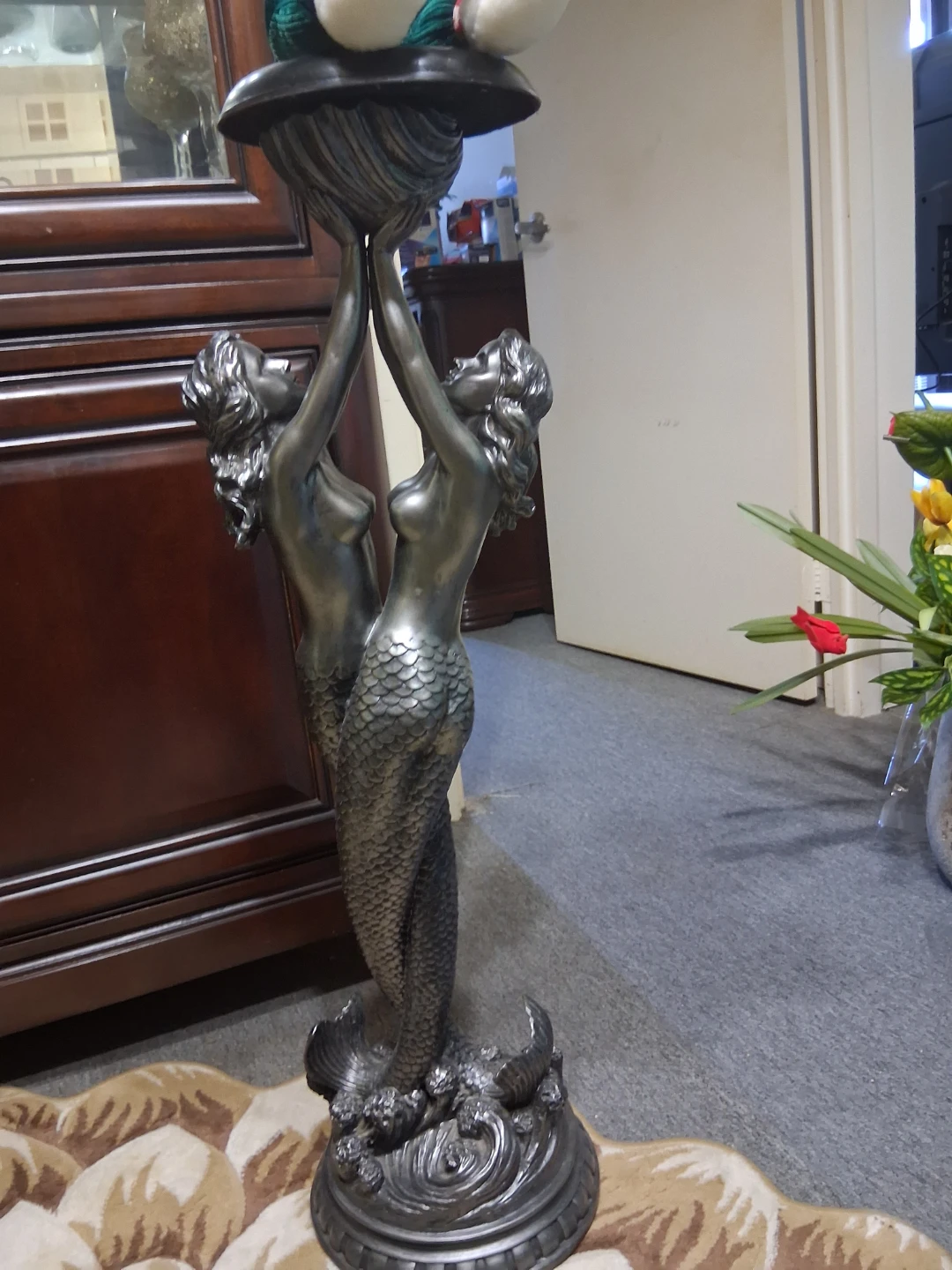 Statue of two mermaids decor.