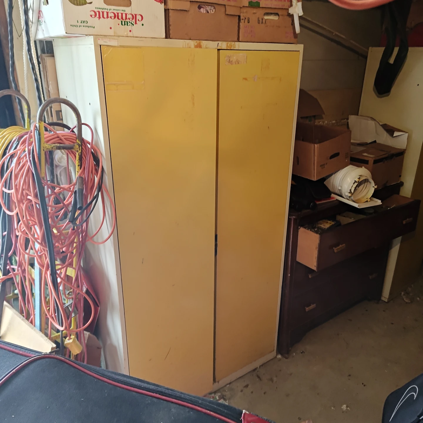 Tall metal storage cabinet with shelves
