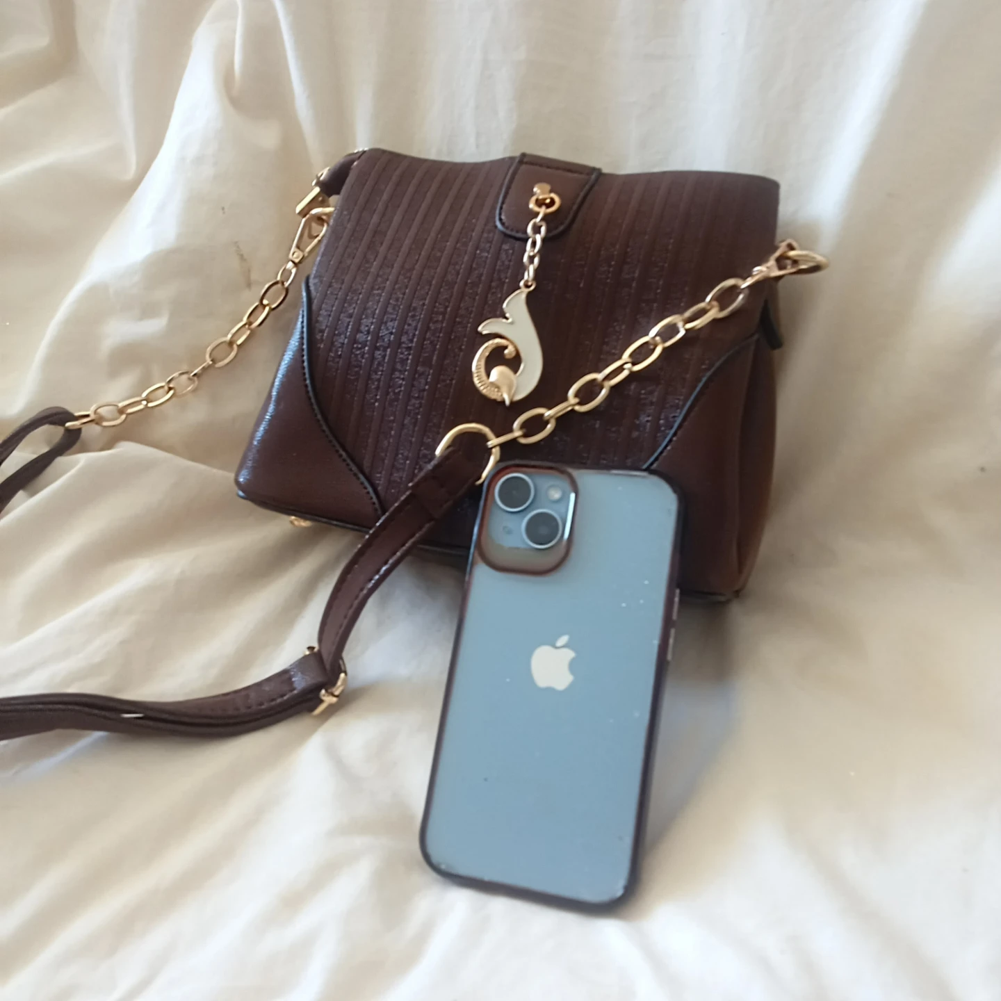 Brown textured crossbody bag with gold chain