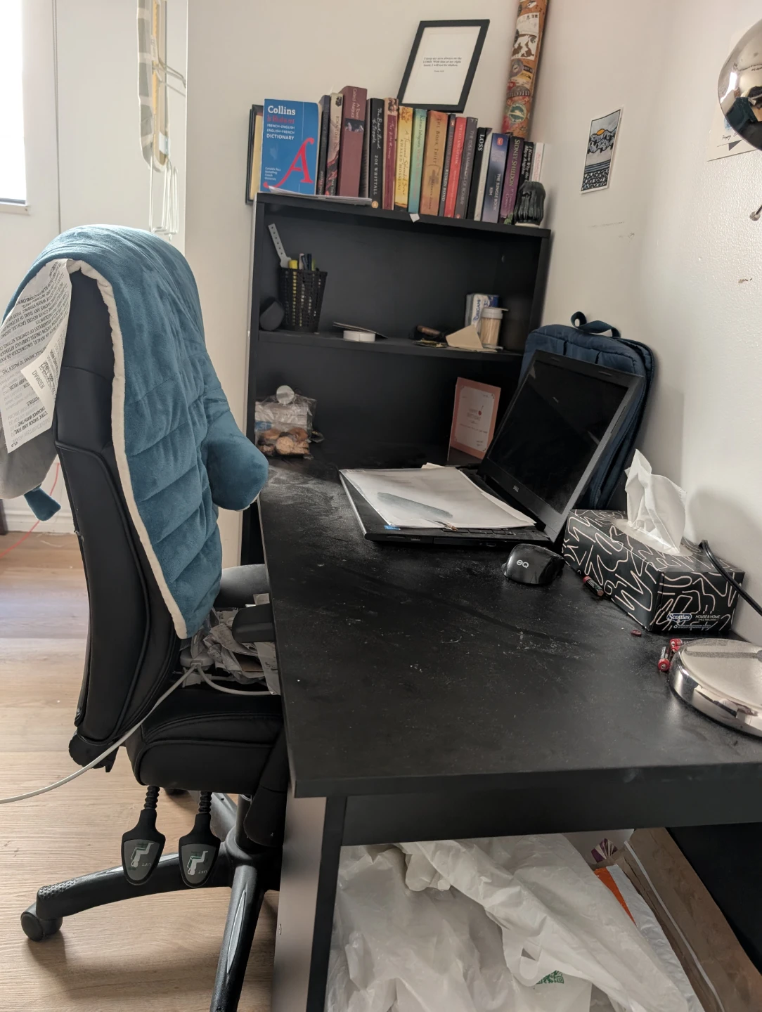 Black computer desk with bookshelf with swivel chair