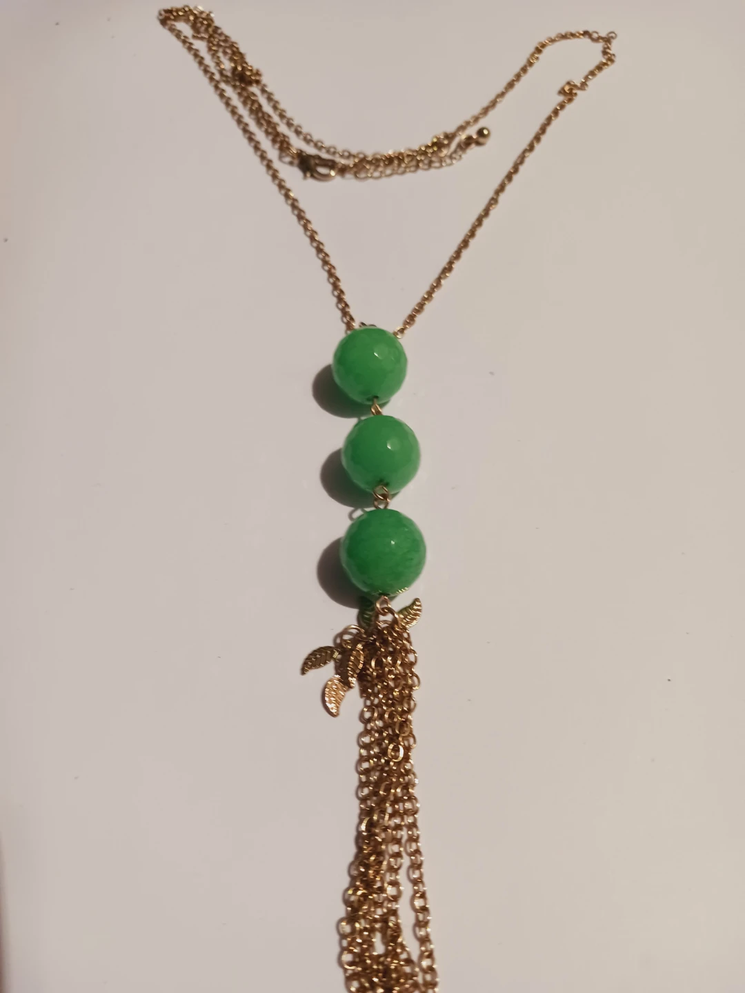 Gold tone necklace with green beads and tassel - photo 2