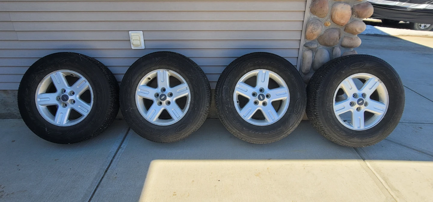Goodyear Assurance tires with rims