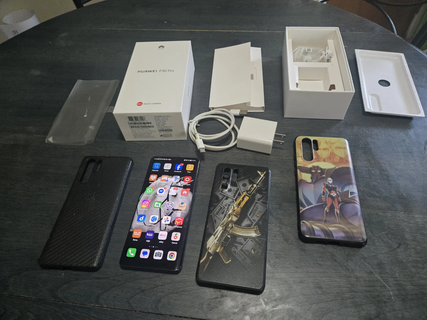 Huawei P30 Pro smartphone with charger and case