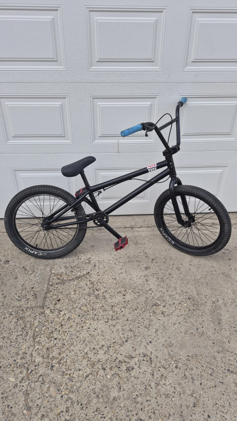 Black BMX Bike with Blue Grips