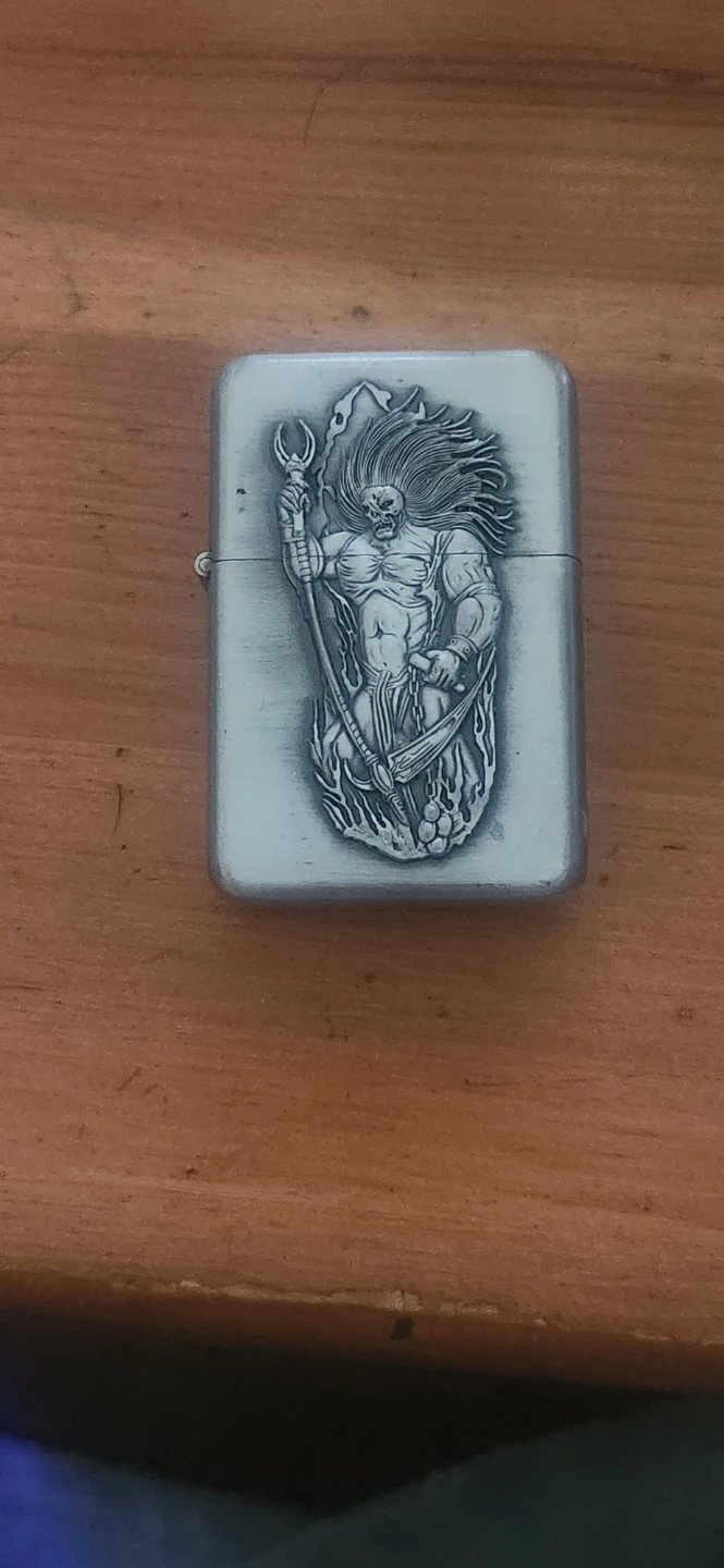 Vintage Metal Lighter with Demonic Figure Design