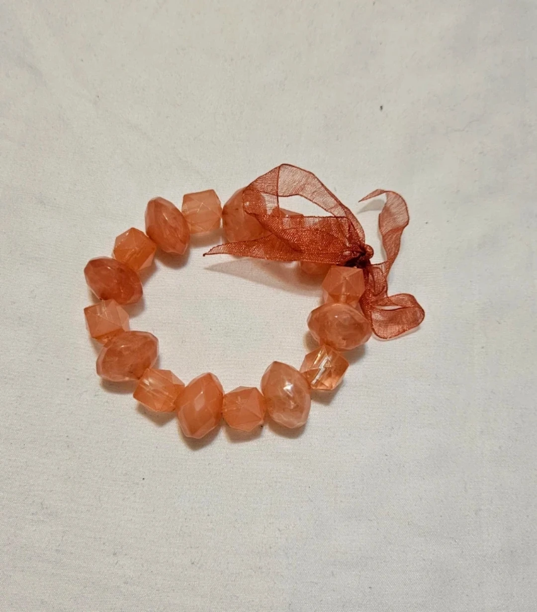 Coral jewel bracelet with bow