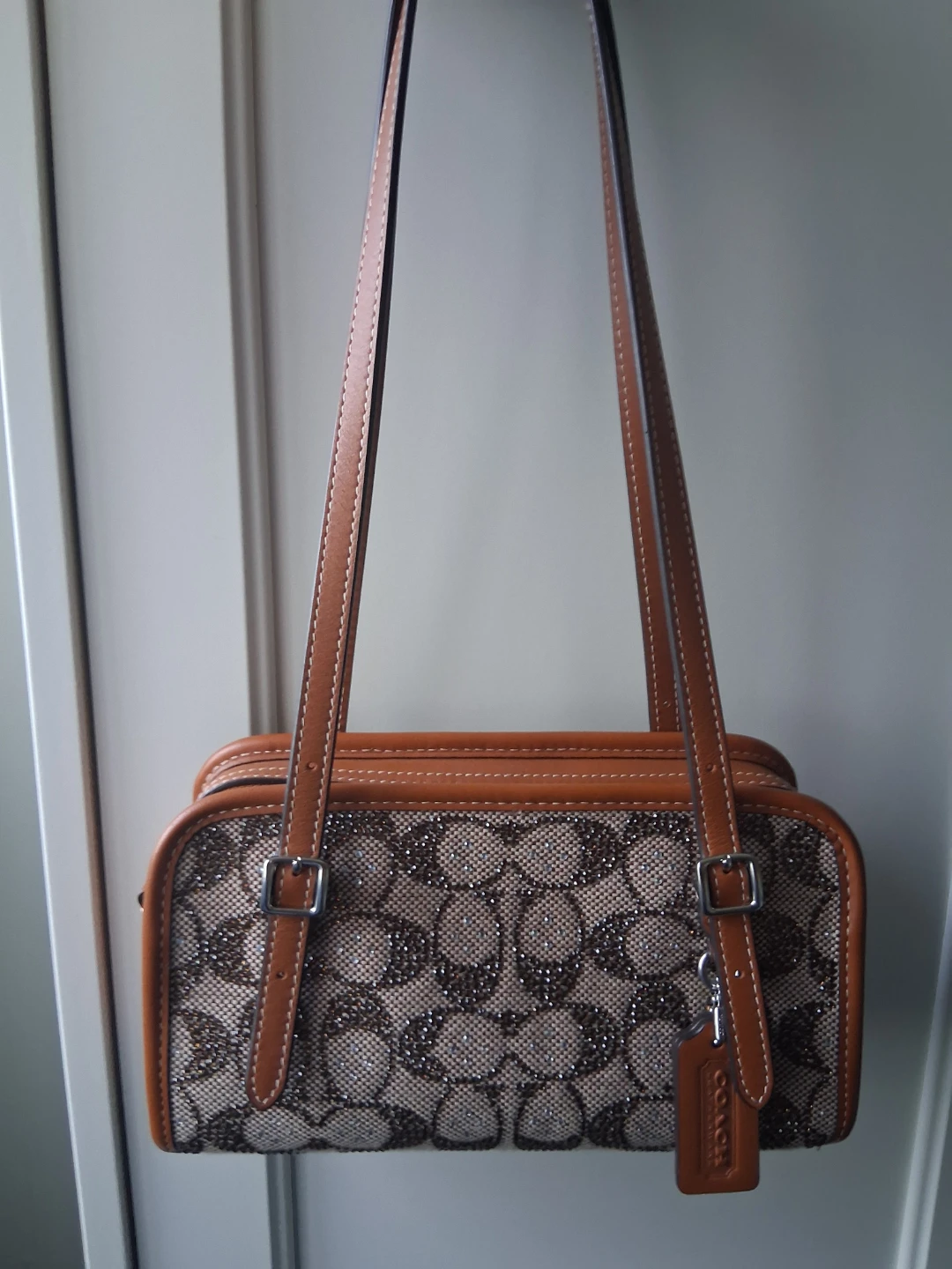 Coach Signature crystal swing zip