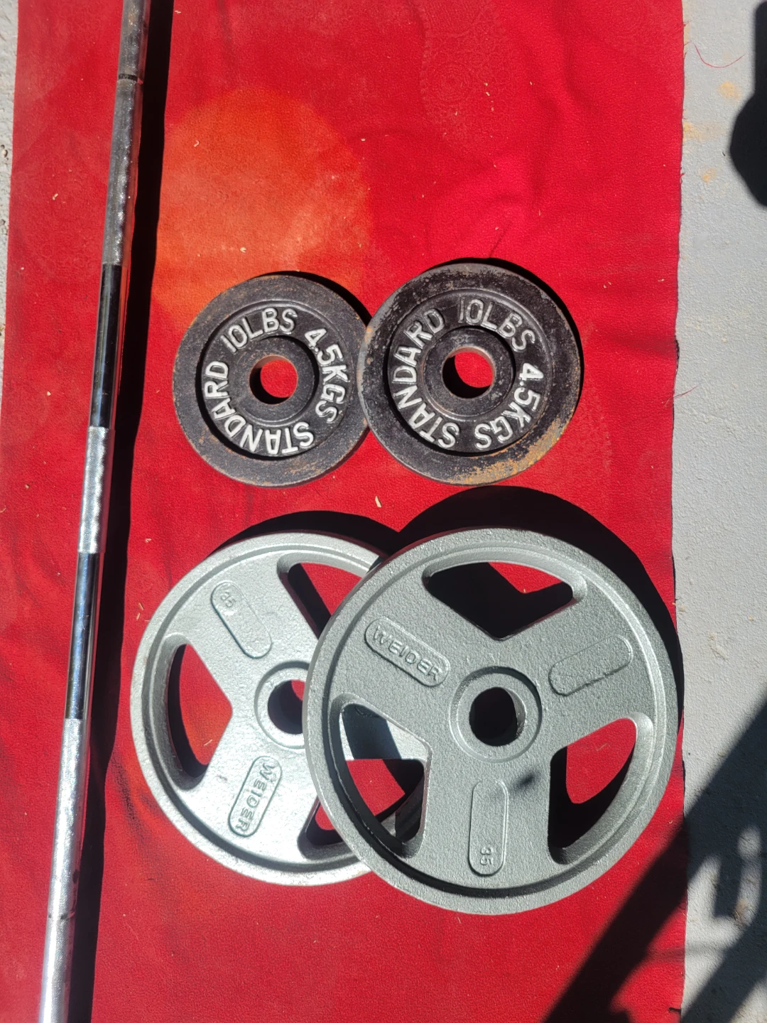 OLYMPIC 7' BAR.  45LBs AND 90LBs  2-35s. 2-10s - photo 2