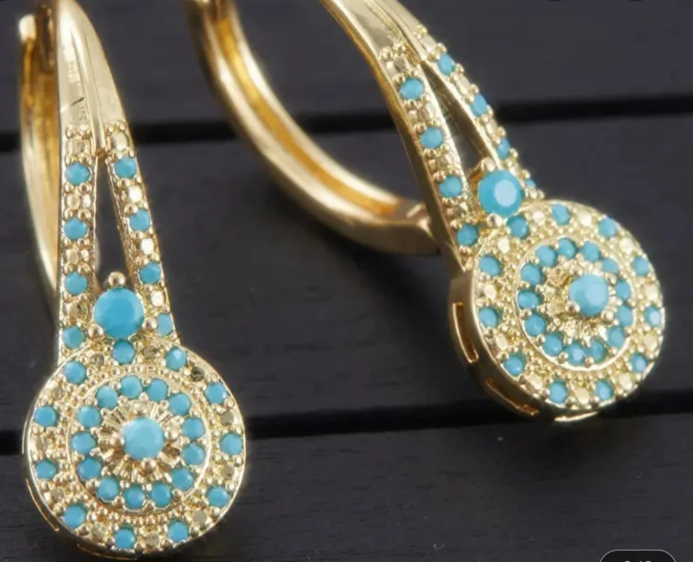 Gold-tone earrings with turquoise accents