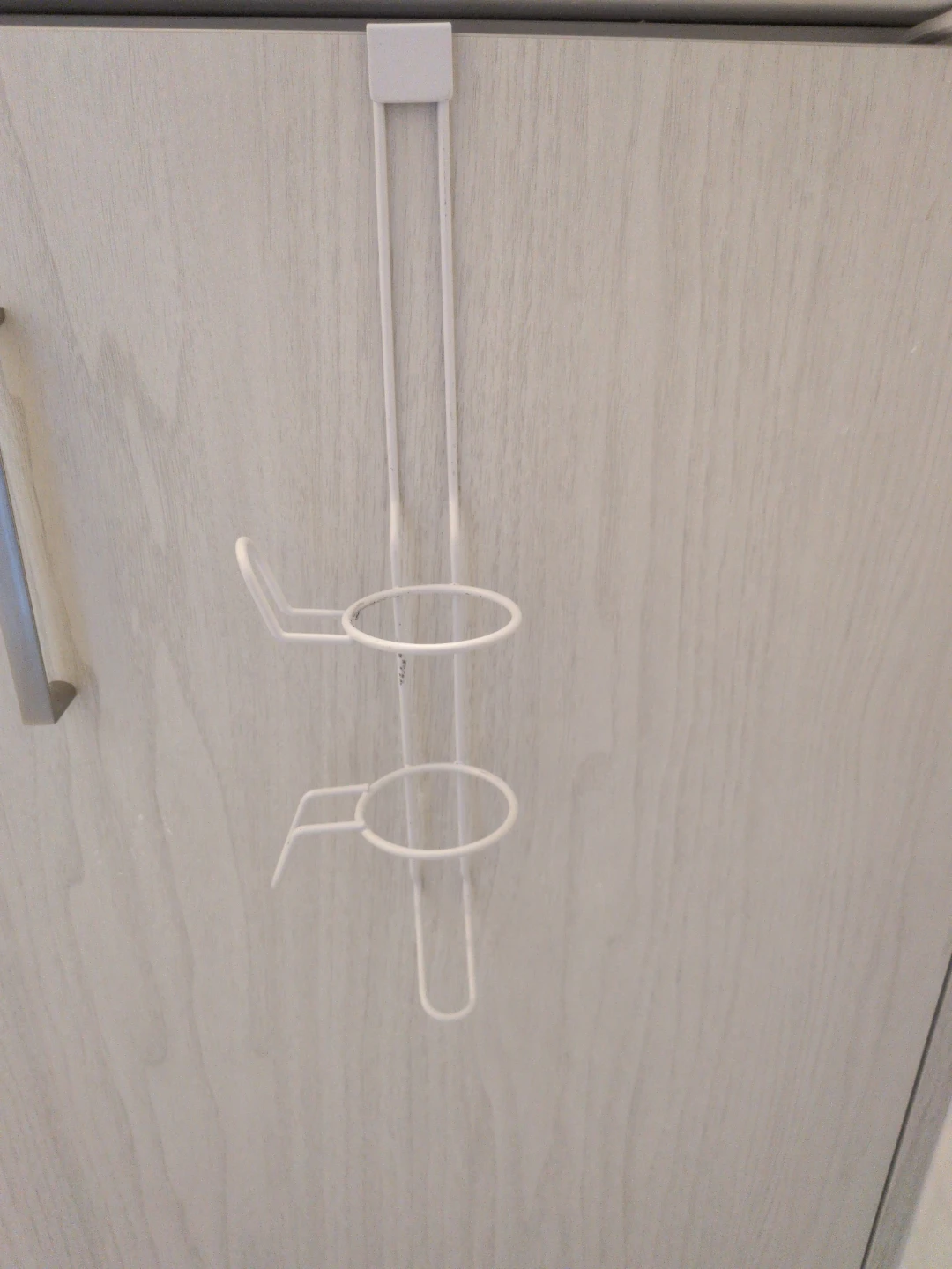 White metal over-the-door hair curler holder