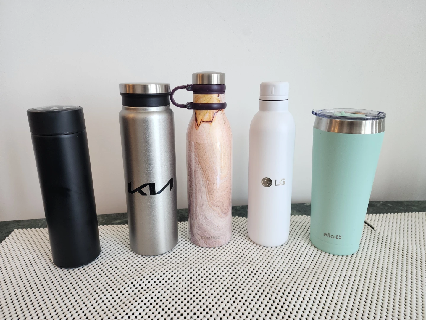 Collection of unused kitchenware, waterbottles, whiskey glasses.