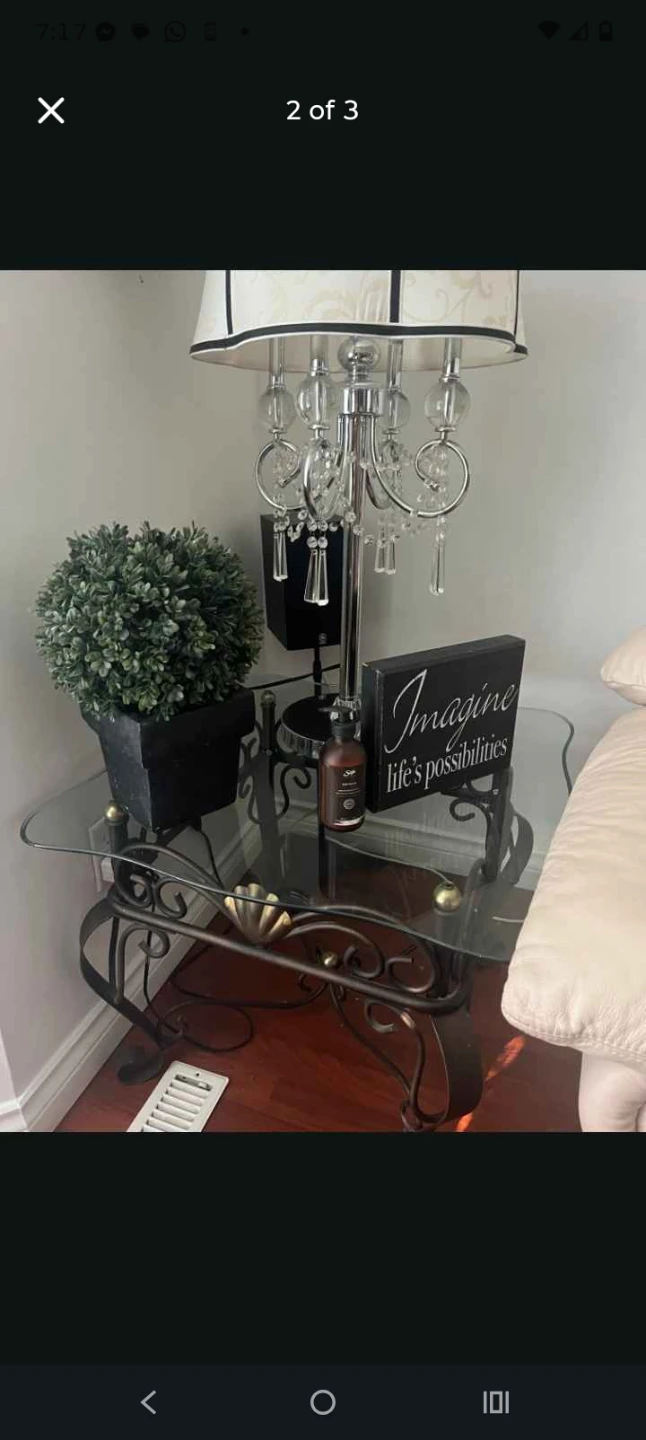 Glass top coffee table with ornate metal base - photo 2