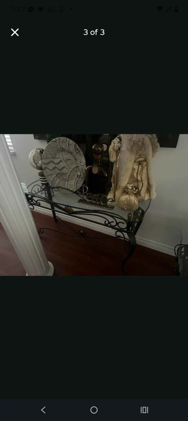 Glass top coffee table with ornate metal base - photo 3