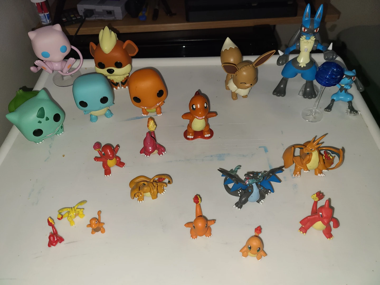Lot of Pokemon mega construx, funko pops, and other figures