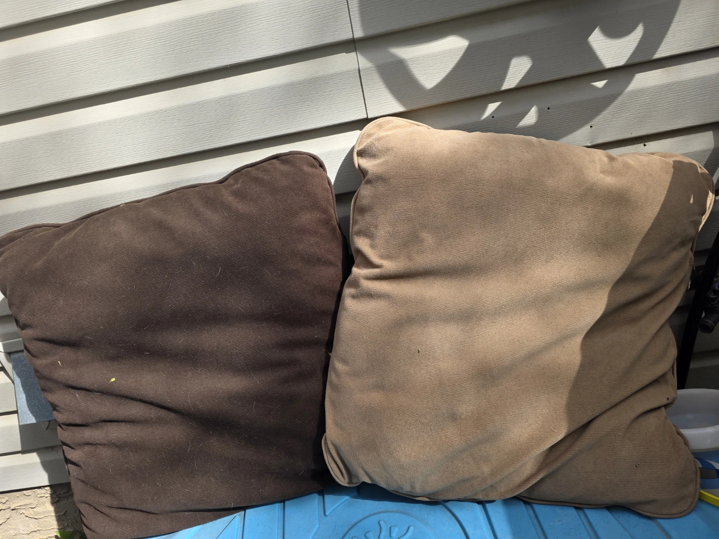 Two brown and tan large throw pillows
