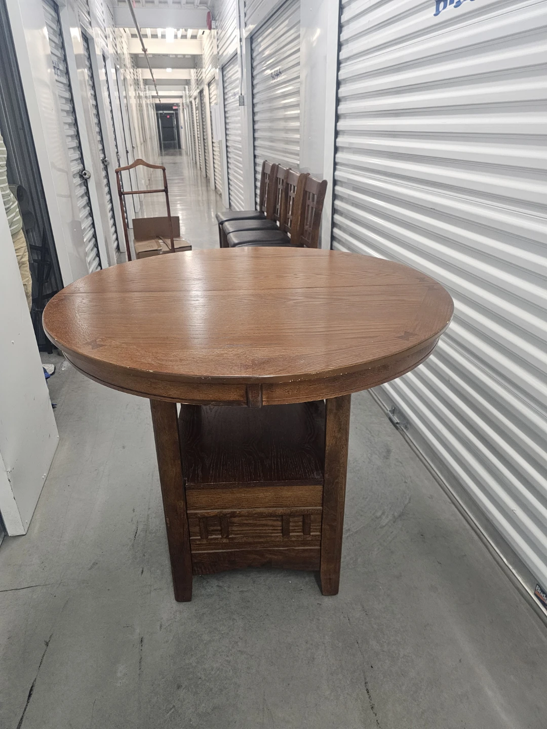 Wood table and stools with black seats