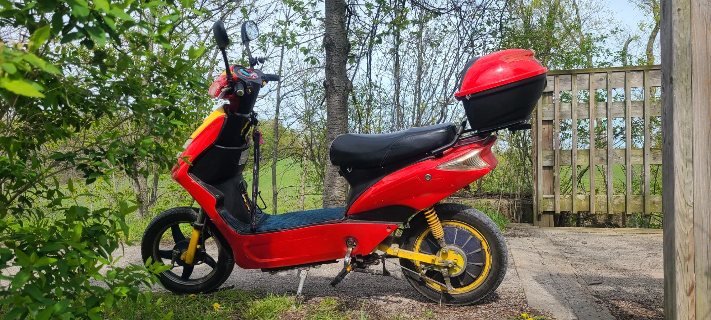 Red Electric Scooter with Storage Box